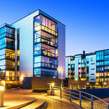 House building and city construction concept: evening outdoor urban view of modern real estate homes