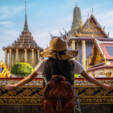 Asian woman traveller take a photo and travel in Bangkok grand palace and wat phra kaew in Bangkok c