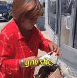 Unbothered 02 Old black woman outside pulling a cigaratte out of her purse and putting it in her mou.gif