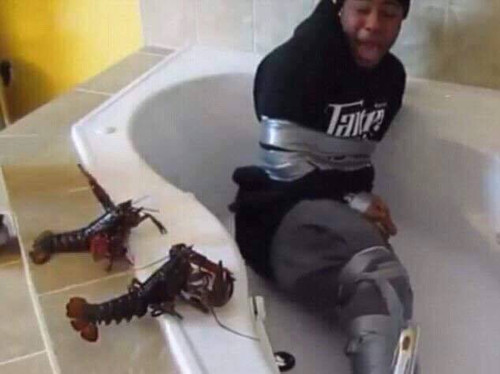 Scared Frightened 04 Black guy tied up in a tub by lobsters.jpg