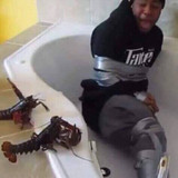 Scared Frightened 04 Black guy tied up in a tub by lobsters