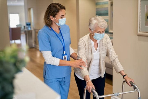 nurse walking with an elderly patient.jpg