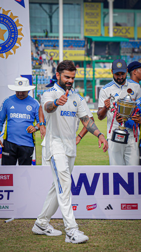 Kanpur: Indian cricket team players pose for photograpers with the trophy after winning the second t.jpg