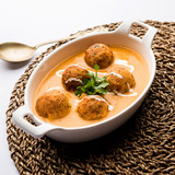 Malai Kofta Curry is a Mughlai special recipe served in a bowl. Selective focus