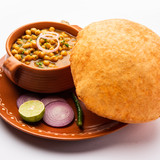 Chole bhature is a North Indian food dish. A combination of chana masala and bhatura or puri