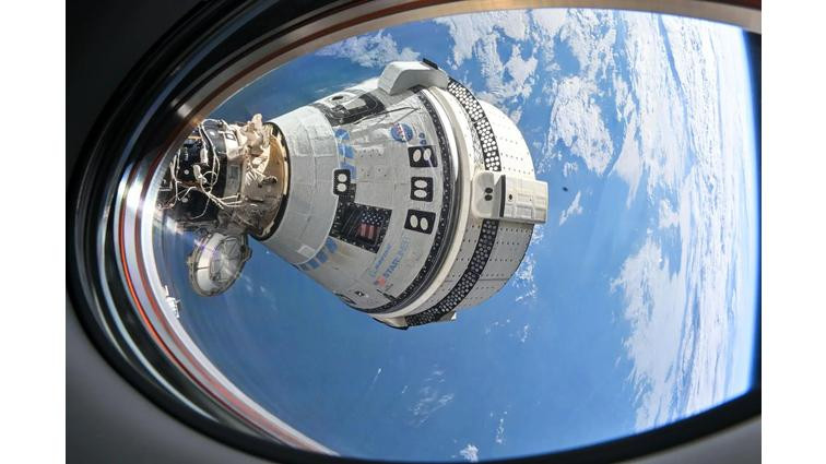 None A photo showing the Starliner spacecraft docked at the ISS