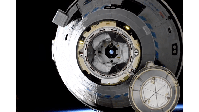 None A picture of Starliner taken as it slowly floats away from the International Space Station just after undocking.