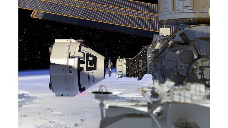 None Boeing’s Starliner spacecraft next to the International Space Station.