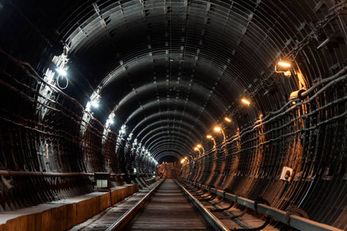 Straight circular subway tunnel with tubing and two different lights: white and yellow..jpg