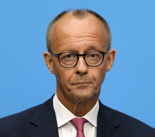 German opposition leader and Christian Democratic Union party chairman Friedrich Merz watches the me.jpg