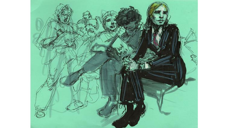 None Chelsea Manning sits with other supporters while waiting for the Luigi Mangione hearing to commence.