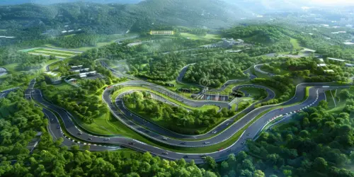 aerial view winding race track surrounded lush greenery high angle snaking forest trees hills creati.webp
