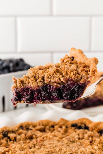 Blueberry Crumble Pie slice of pie out of the pan 33.jpg