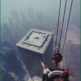 Construction workers installing the antenna on the top of the World Trade Center, 1979
