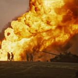 US Marines silhouetted against a burning oil well, Desert Storm 1991