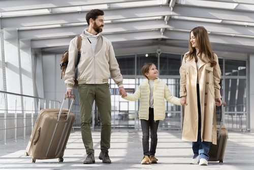 full shot parents kid traveling.jpg
