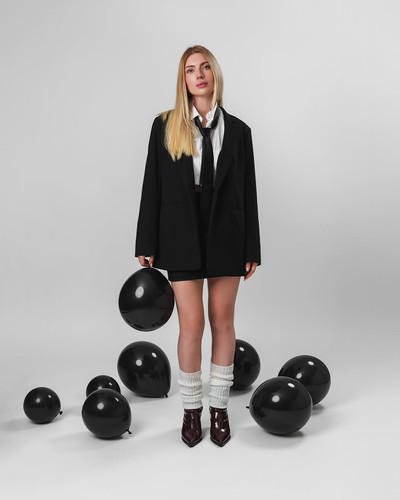 Black balloons on a white background — a reminder that there’s room for depth in simplicity…Photogra.jpg