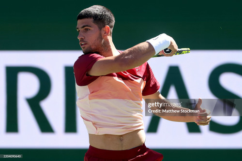 INDIAN WELLS, CALIFORNIA - MARCH 08: Carlos Alcaraz of Spain returns a shot to Quentin Halys of Fran.jpg