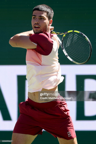 INDIAN WELLS, CALIFORNIA - MARCH 08: Carlos Alcaraz of Spain returns a shot to Quentin Halys of Fran.jpg