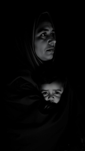 A%20black%20and%20white%20photograph%20depicts%20the%20upper%20body%20of%20a%20Middle%20Eastern%20mo.jpg