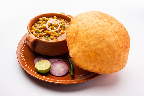 Chole bhature is a North Indian food dish. A combination of chana masala and bhatura or puri.jpg