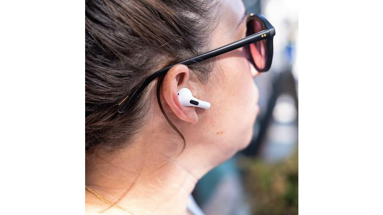 None Apple’s second-generation AirPods Pro pictured in a side profile photo of a woman’s head.