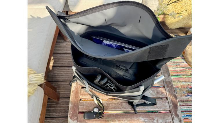 <em>The laptop slides deep into a lightly padded pocket where it’s worn against the body. The Henry holds lots of gear.</em>” title=”None” onclick=”openModal(this)”></div><div class=