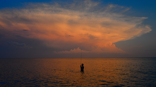 My boy fishing in the sunset.jpg