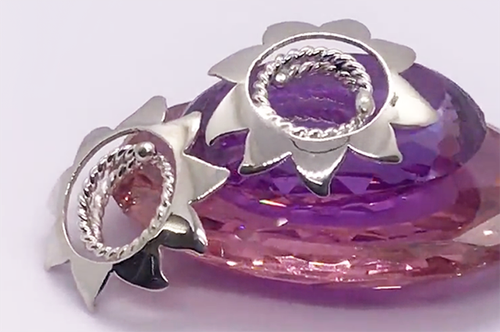 small flower nipple shields on amythest crystal.png
