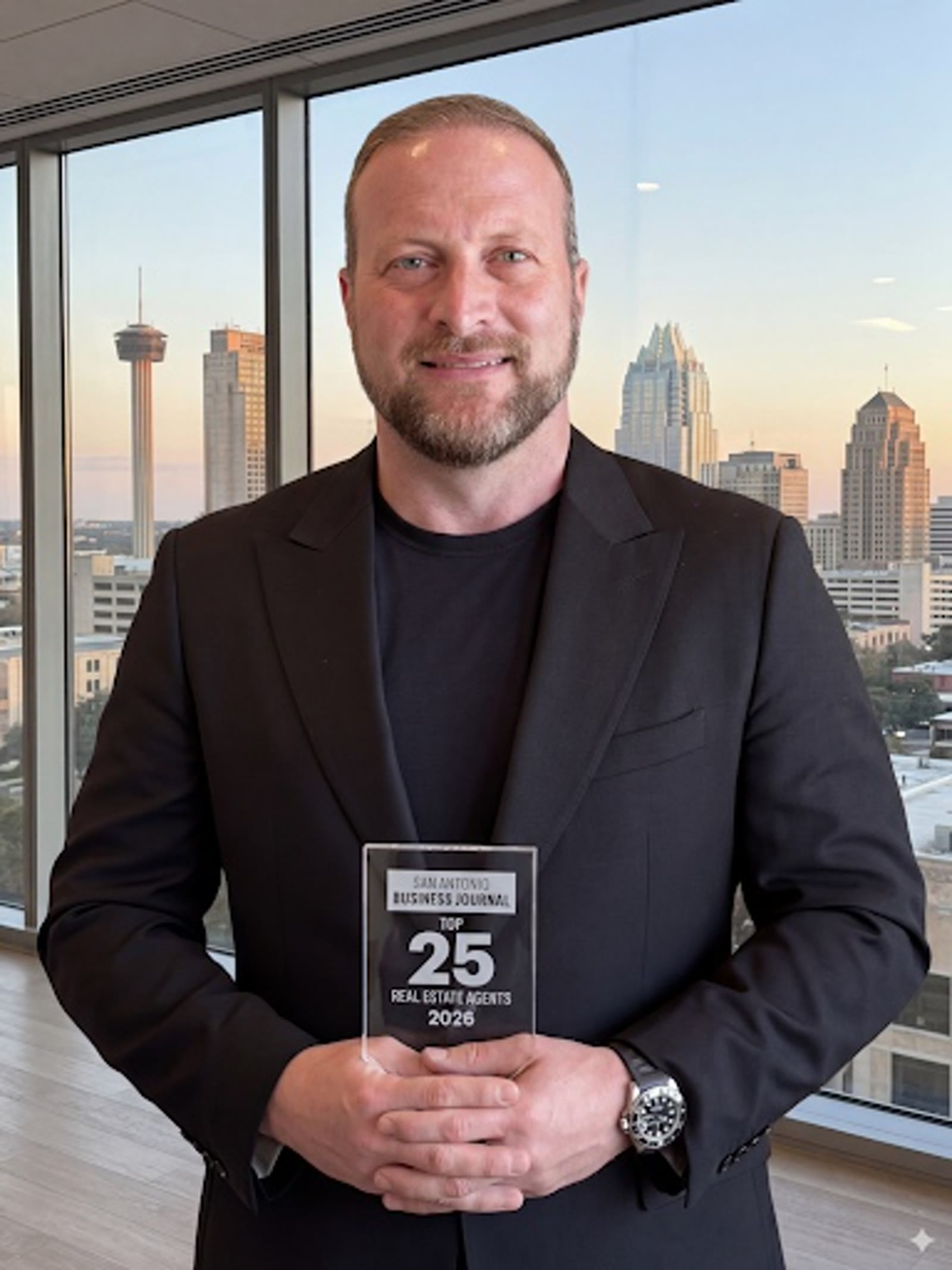 Christopher Beal holding SABJ Top 25 Real Estate Award with San Antonio skyline