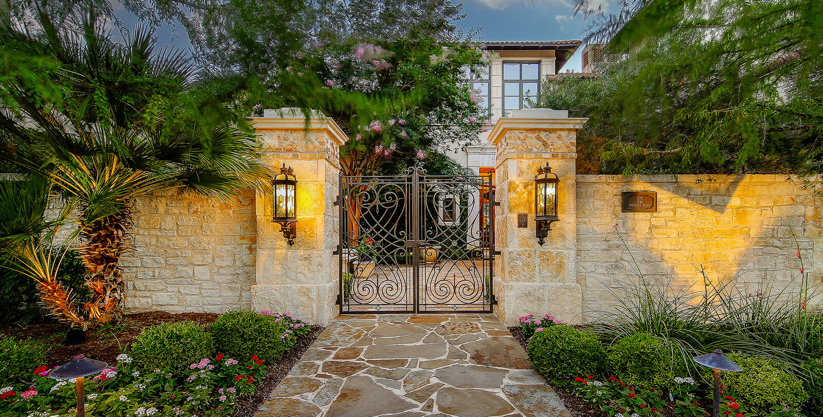 The Dominion San Antonio guard-gated luxury community entrance with estate homes and mature landscaping