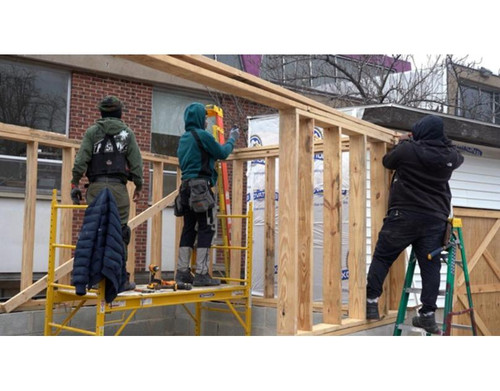 Construction workers building a structural frame on site.jpg