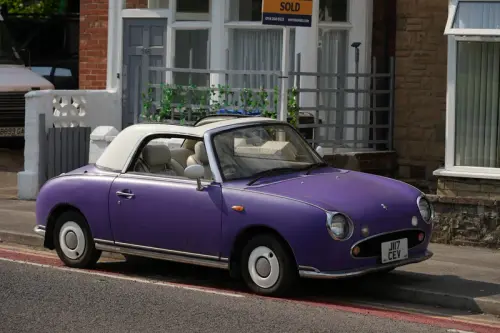 Purple Nissan Figaro. Sony FE 70-200mm F4 Macro G OSS II sample photo. Copyright Joshua Waller.