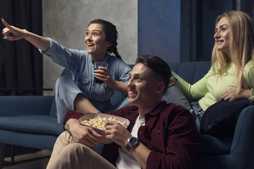 best friends watching streaming service together living room.jpg