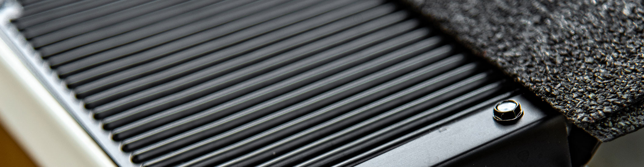 Clean Raindrop gutter guard panel close-up showing protected gutter system
