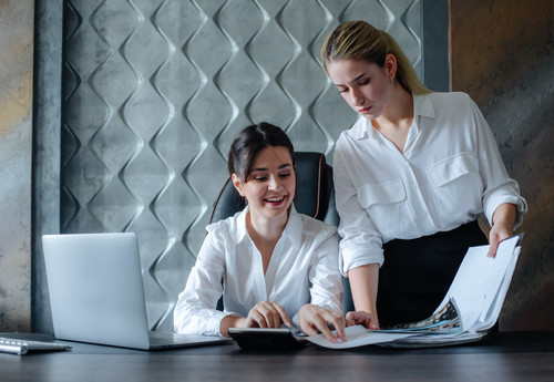 young business lady female director sitting at office desk working process business meeting working .jpg