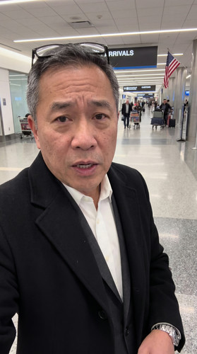 airport arrivals asian male ref.jpg