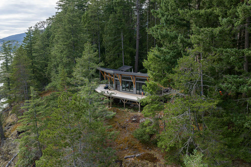 gambier island residence bc aerial cabin forest canopy elevated deck.jpg