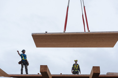 steelwood structure squamish crew measuring timber beam.jpg