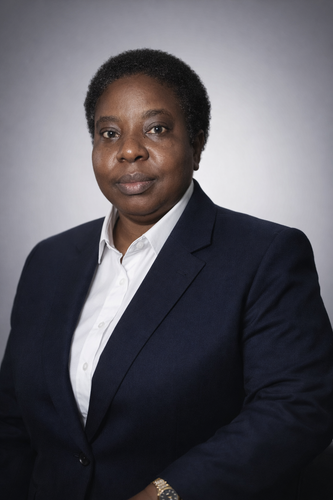 Professional headshot with navy blue suit.png