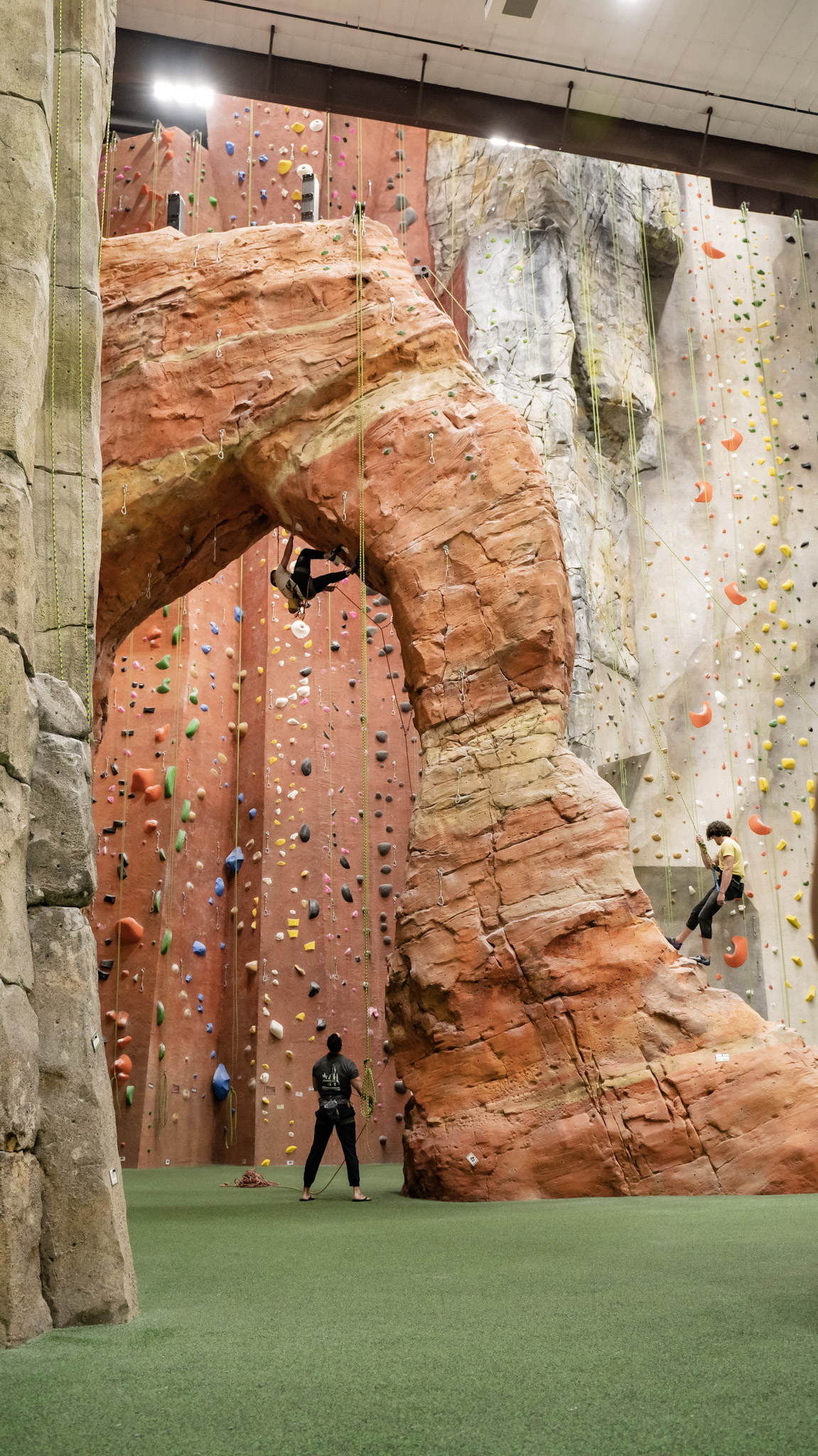 Natural-feature arch wall inside the gym inspired by outdoor climbing destinations