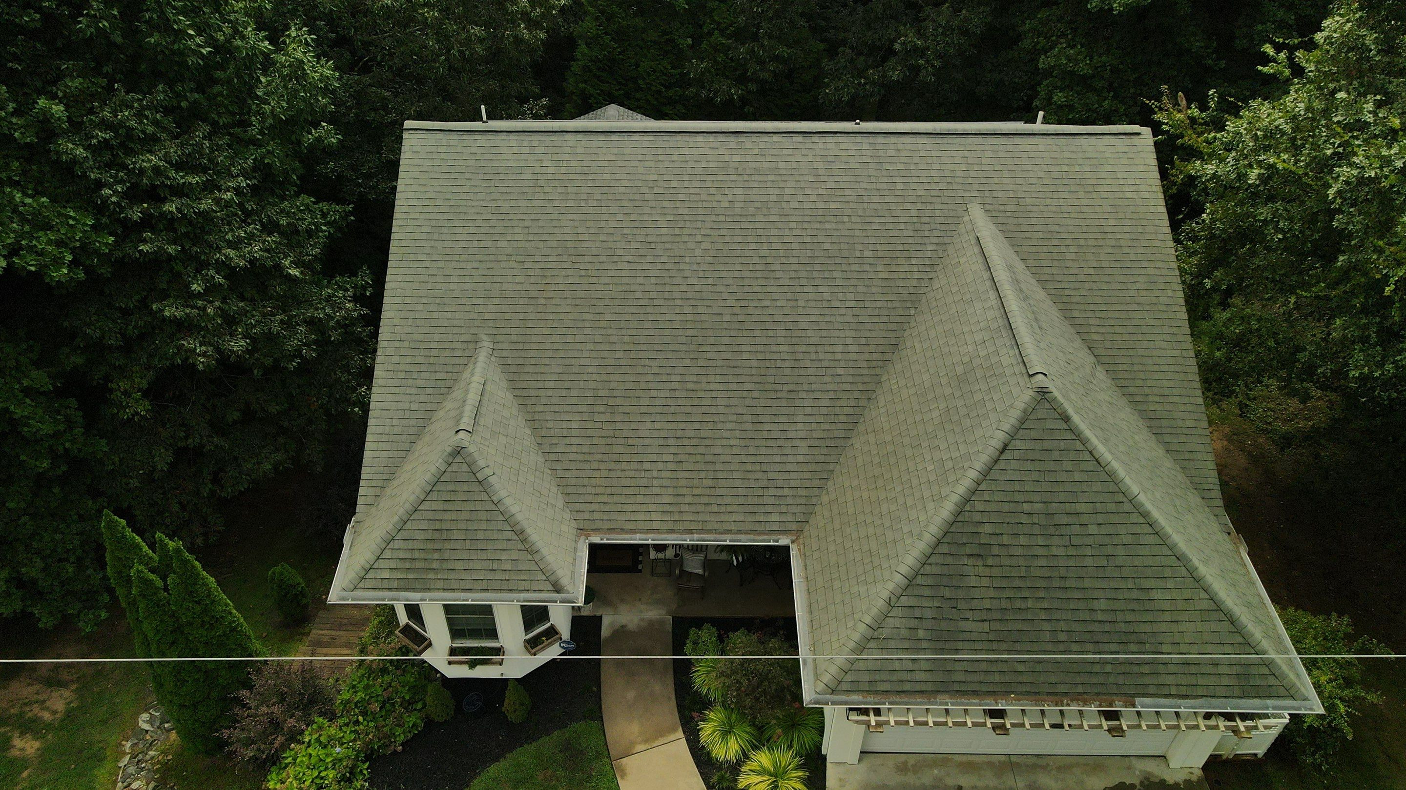 Same roof after professional soft wash — all black algae streaks completely removed