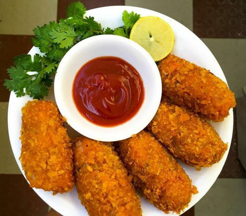 Plate full of crunchy 🍘 vegetables 🥦🍅🥕🧅🌶 cutlets & tomato sauce 🥫.jpg