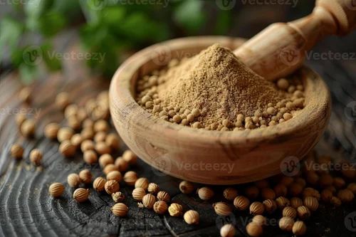 spice essence celebrated in rustic composition of coriander seeds and powder in mortar photo 500x500.jpg