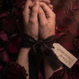  Two hands tied together with 202605030007