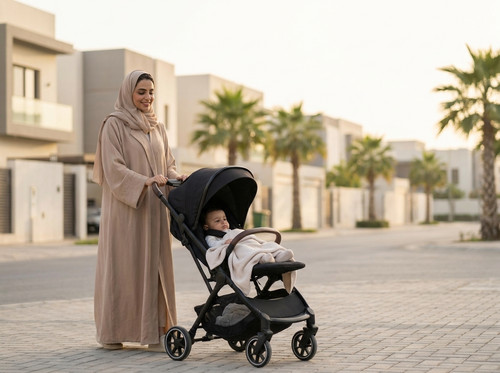 Mother pushing baby stroller out… 202605030004.jpg