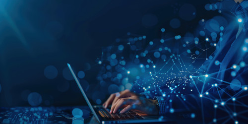 businessman using laptop with glowing network connections representing global business technology.jpg