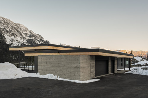 warbler residence whistler exterior front concrete metal mountain backdrop.jpg