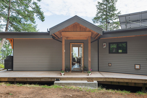 gambier island residence bc exterior front entry timber gable lap siding.jpg