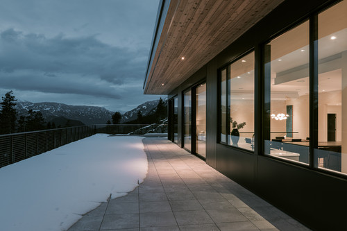 warbler residence whistler exterior deck twilight interior glow mountain.jpg